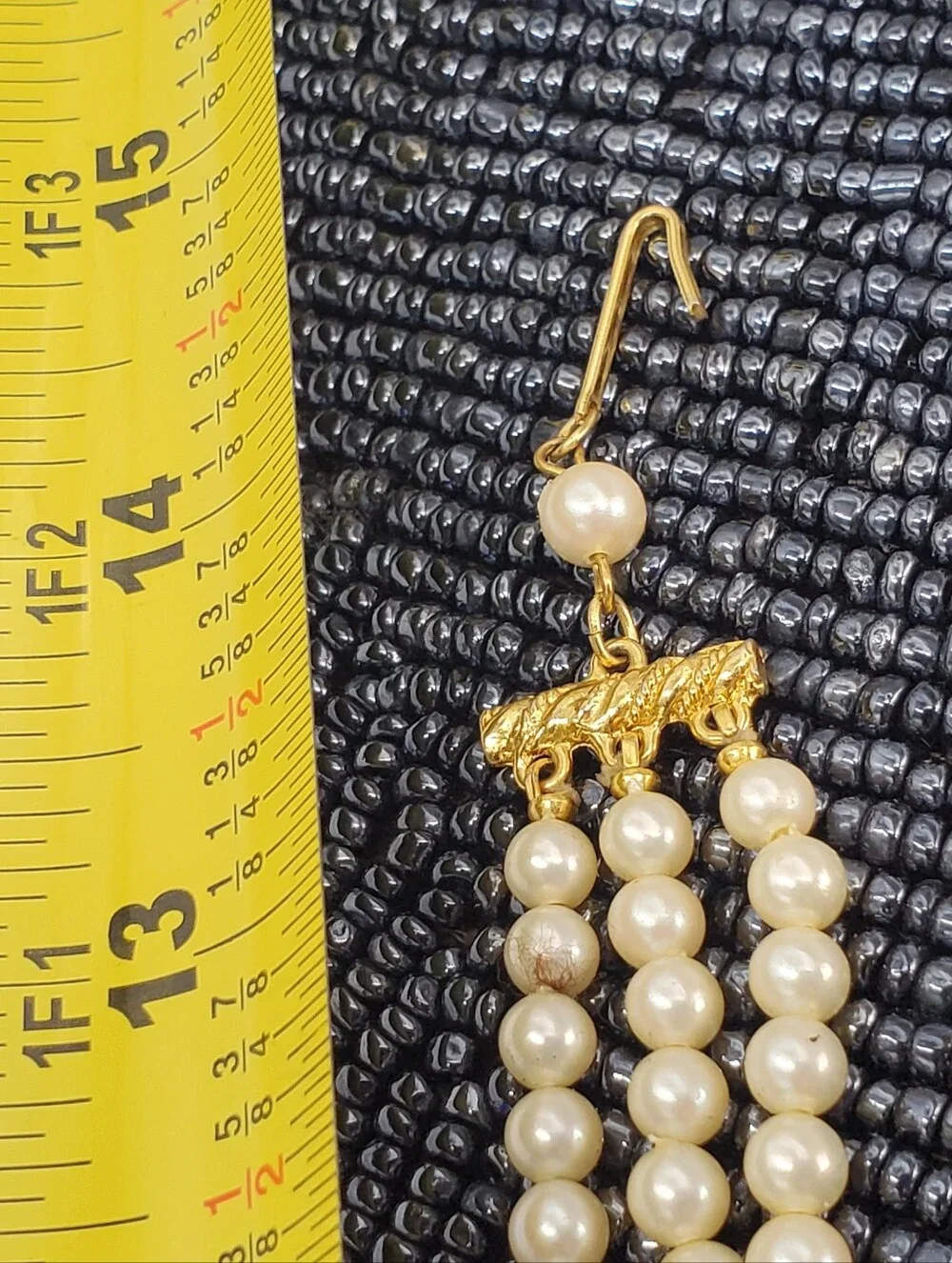 Vintage-style 3-strand pearl choker necklace with a prominent cameo centerpiece